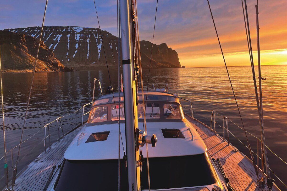 Sailing yacht at sunset on a very calm sea