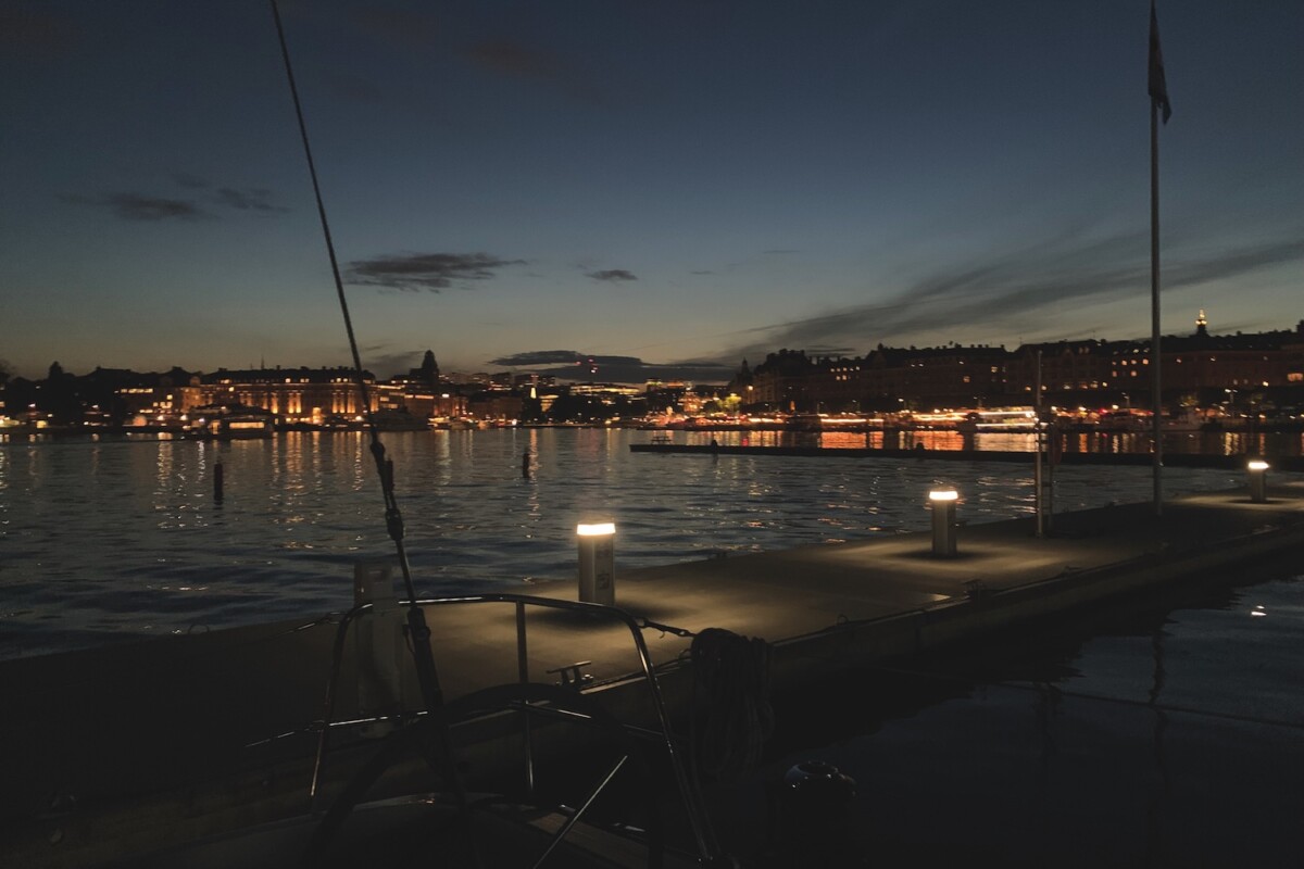 Evening panorama of Stockholm with lights on the shore reflected in the water