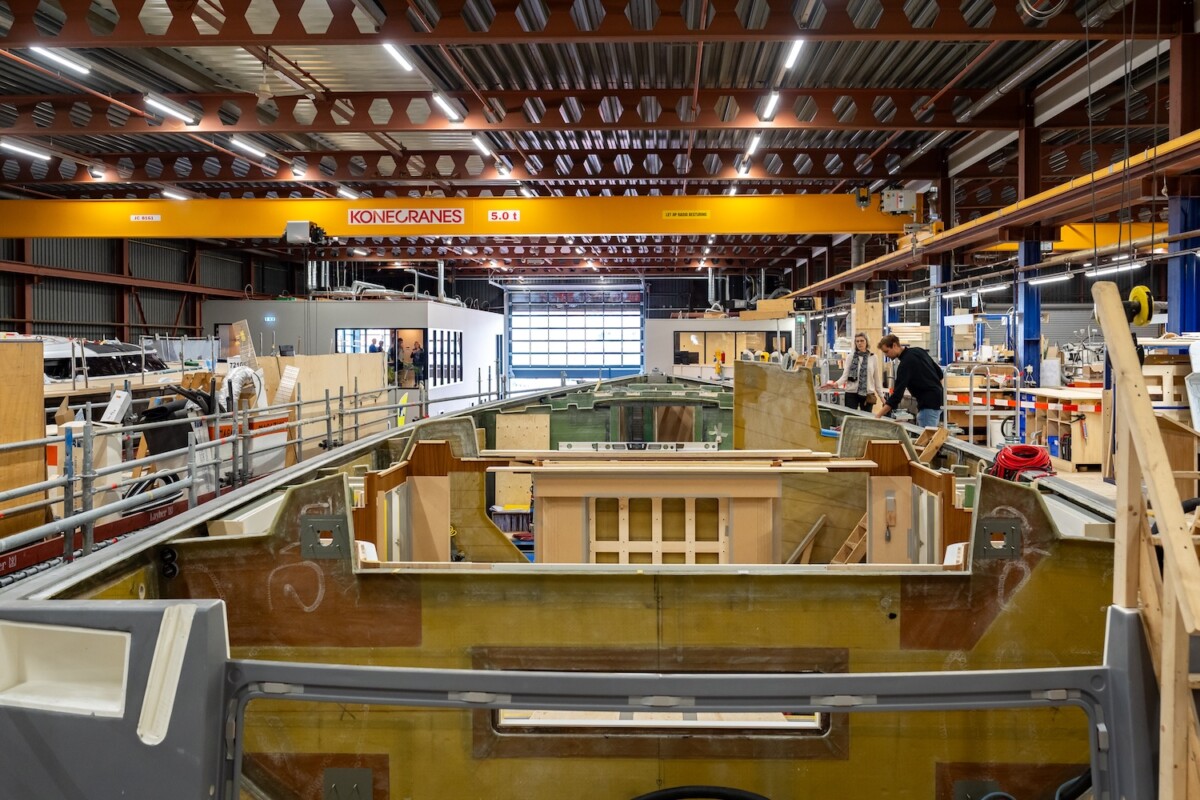 Factory with sailing yacht hull in build showing the bulkheads made of wood